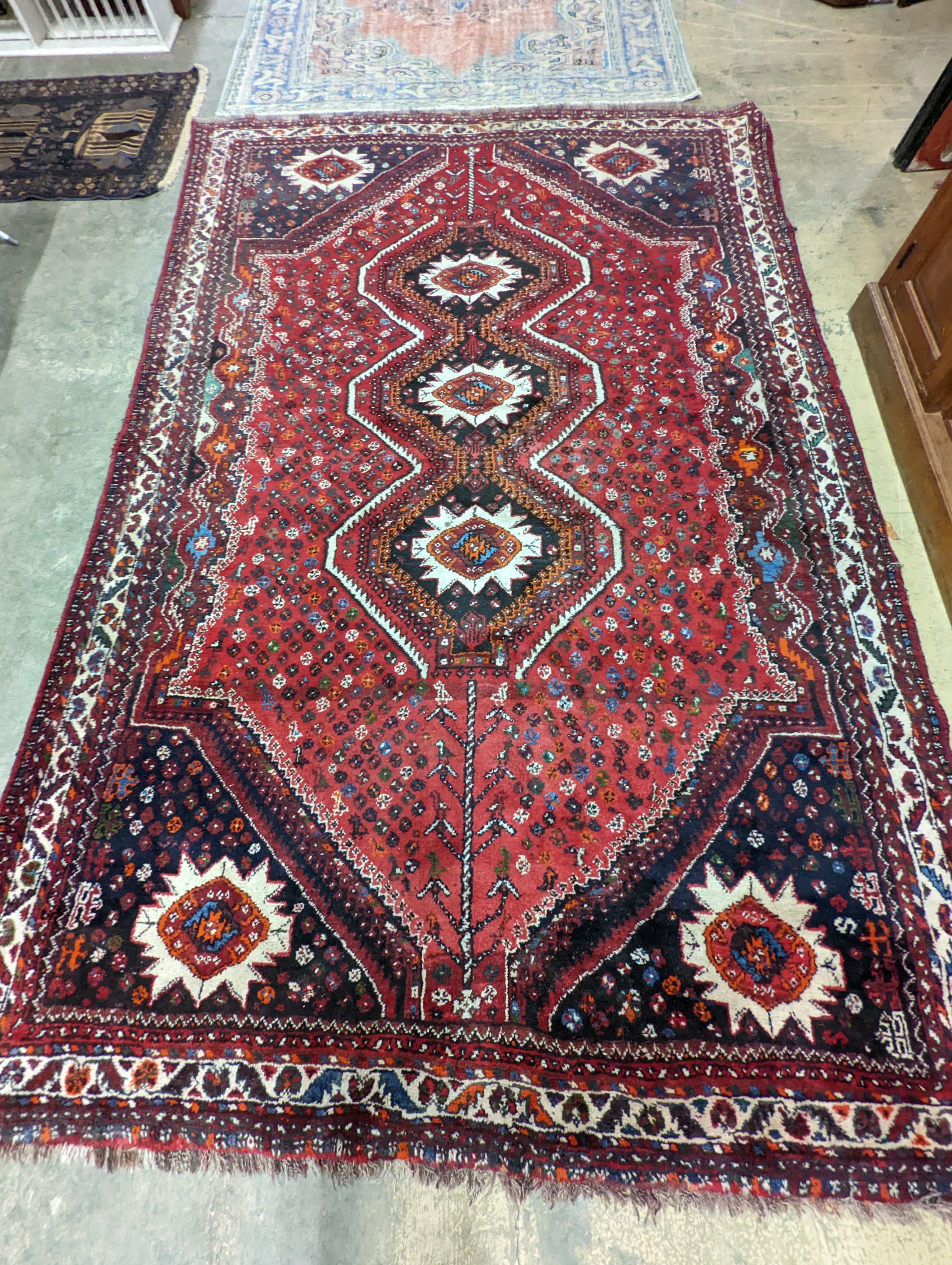 A North West Persian red ground carpet, 335 x 220cm